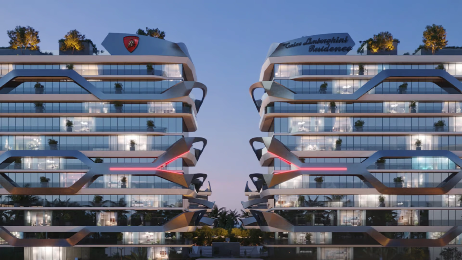 Illuminated high-rise towers of Signature Global Tonino Lamborghini Residences in Sector 71 Gurgaon with Lamborghini branding, rooftop greenery, and modern glass architecture.