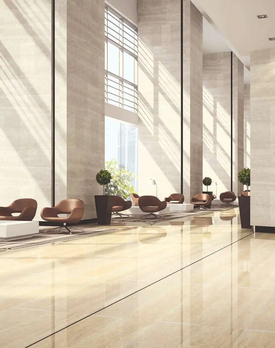 Spacious lobby of Signature Global Tonino Lamborghini Residences in Sector 71 Gurgaon with high ceilings, natural light, modern lounge seating, and landscaped planters.